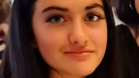 Rachel Halliwell Semina Halliwell looks at the camera in a cropped close-up photo.